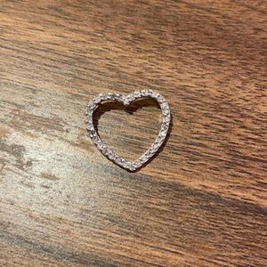 Sterling silver and diamond heart pendant.